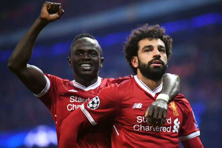Sadio Mane action image for Liverpool with Salah