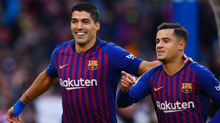 Suarez and Coutinho celebrate